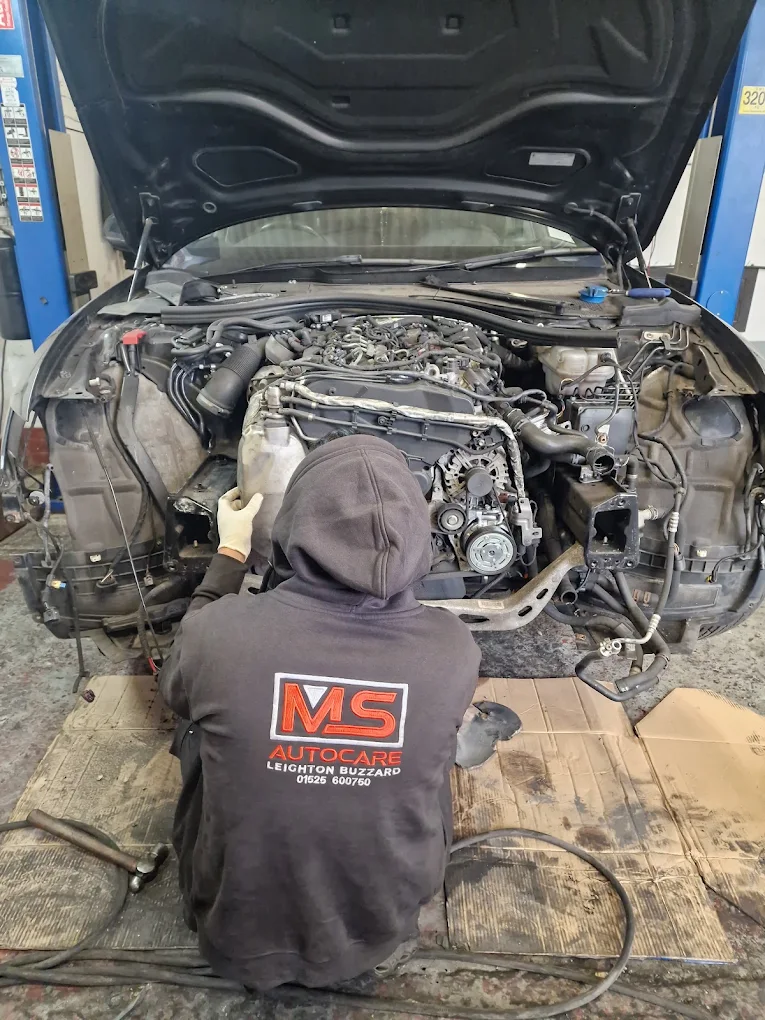 MS Autocare mechanic working on an engine in the Leighton Buzzard workshop